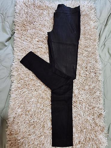 Pantalone: Ženske crne uske pantalone Dolce Gabbana sa kožnim efektom. - — 1