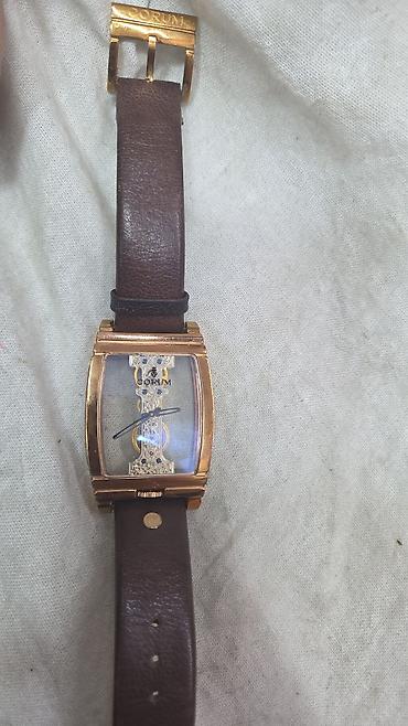 qizil mirvari: İki ədəd qol saatı dəsti 1) Corum - Korpus: tonneau formalı, qızılı — 1