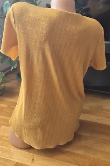 Bluze: Sedam bluzica sa neznatnim tragovima korišćenja. Zelena - M veličina — 8