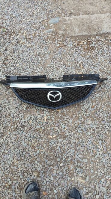 стекла фар: Решетка радиатора Mazda Б/у, Оригинал