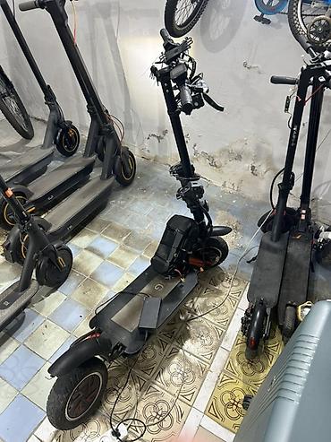 электросамокат бу: Elektrikli skuter. Şəkillərdə qara rəngli, iri təkərli elektrikli — 6