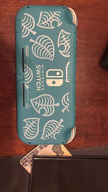 nintendo switch 3 lite: Nintendo switch lite üzerinde cantası. hic bir problemi yoxdu — 2
