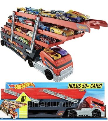 игрушка поезд с рельсами: Игровой набор Hot Wheels Mega Hauler представляет собой большой