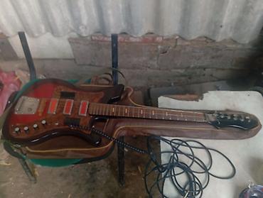 elektron gitara satisi: Elektrik gitara – vintage üslublu, 1960–70-lar dizaynına bənzər korpus — 1