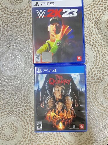 Oyun diskləri və kartricləri: PS5 üçün WWE 2K23 və PS4 üçün The Quarry oyunları. Hər iki oyun da
