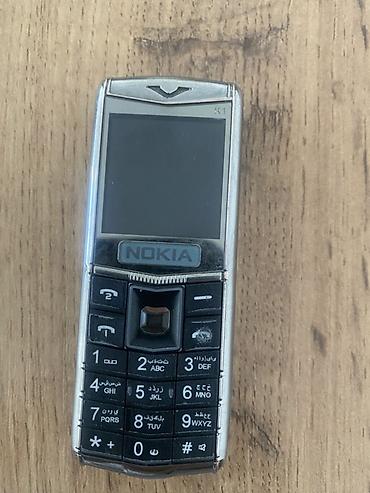 стойка микрофон: Телефон Nokia с металлическим корпусом и классической цифровой — 3