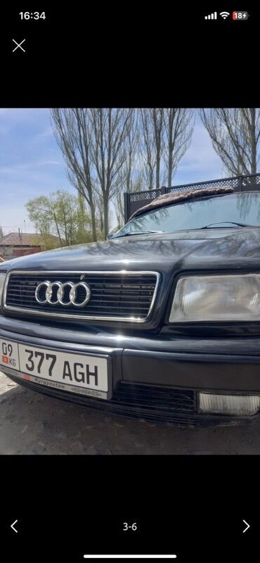 мотороллер муравей с кабиной цена: Автомобиль Audi черного цвета с характерной решеткой радиатора и