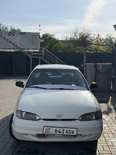 shevrolet lacetti: Sedan компакт-класса, 4 двери, белый цвет. Киргизские номера (KG) — 9