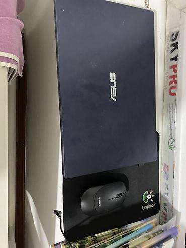 Ноутбуки ASUS: Ноутбук ASUS - Тонкий корпус, тёмно-синий цвет, логотип ASUS на — 2