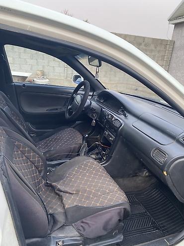 пинин ио: Mazda Cronos: 1994 г., Механика, Бензин, Седан — 6