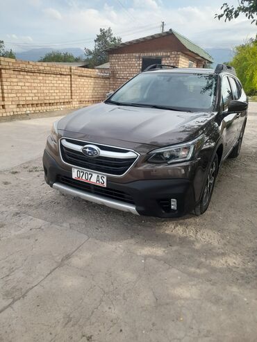 авто росрочка: Subaru Outback коричневого цвета. Автомобиль оснащен багажником на