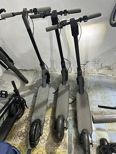электросамокат бу: Elektrikli skuter. Şəkillərdə qara rəngli, iri təkərli elektrikli — 4