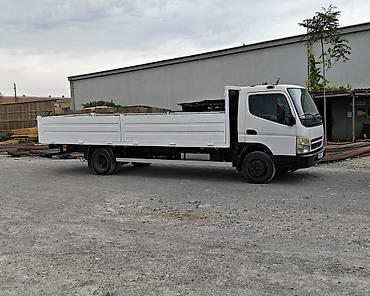 aka maşın: Mitsubishi Canter. Ili2008 3turbo dizel. Uzun bortlu yük maşını – yana — 2