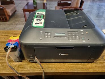 принтер цветной: Многофункциональное устройство Canon черного цвета, предназначенное
