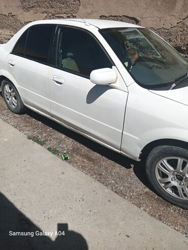 авто рассрочку без банка: Mazda Familia: 2001 г., 1.6 л, Автомат, Бензин, Седан