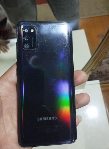 samsung 9: Samsung Galaxy A41, 64 ГБ, цвет - Синий, Кнопочный, Отпечаток пальца, Две SIM карты