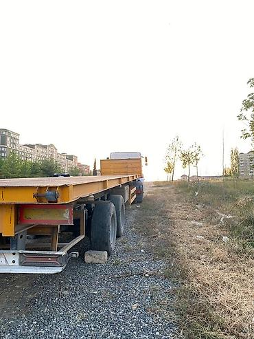 yükləyici traktor: Yük daşıma üçün yarımqoşqu – platforma tipli senetde Meydança qeyd — 2