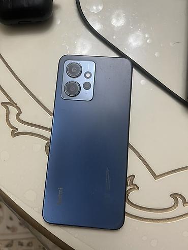 редми ноот 7: Смартфон Redmi (серия Note 12/11-поколение, судя по дизайну) в синем — 2