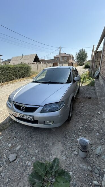 продаю или меняю с доплатой: Mazda 323: 2001 г., Механика, Бензин