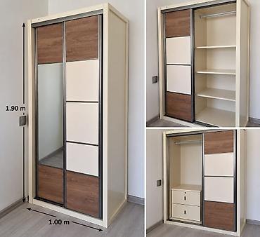 İki qapılı sürgülü dolab Ölçülər: - Hündürlük: 1.90 m - En: 1.00 m -