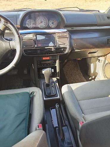 nissan note bufer: Nissan X-Trail (T30) – gümüşü rəngli, benzinlə çalışan kompakt SUV — 4