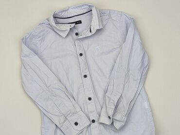 bluzki chłopięce z długim rękawem 134: Koszula 5-6 lat, stan - Dobry, wzór - Jednolity kolor, kolor - Błękitny