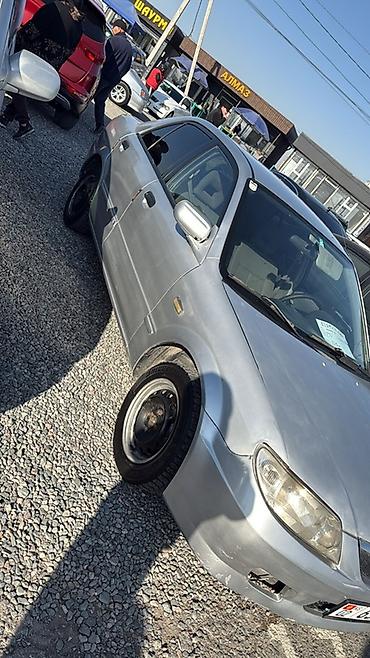 forester 2004: Mazda 323: 2003 г., 1.3 л, Механика, Бензин, Седан — 2