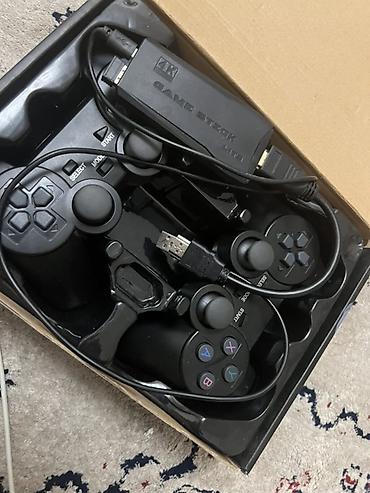 Игровая приставка Game Stick Lite с двумя геймпадами Комплектация: -