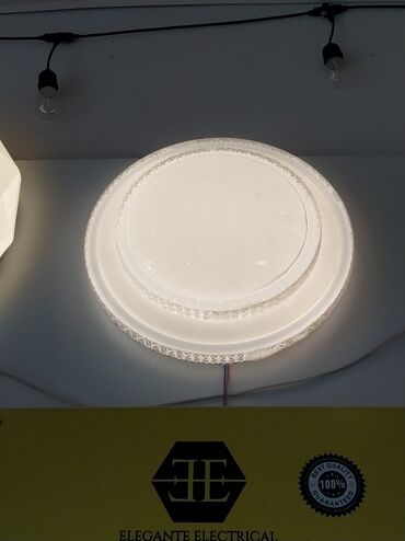 led projektor: Dairəvi formalı, ağ rəngli, tavana bərkidilən lampa. Yüngül dekorativ