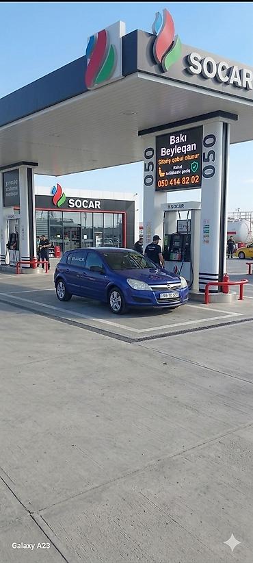 opel astra k: Opel Astra Caravan (universal), mavi rəng. Kuzov: 5 qapılı, geniş — 3