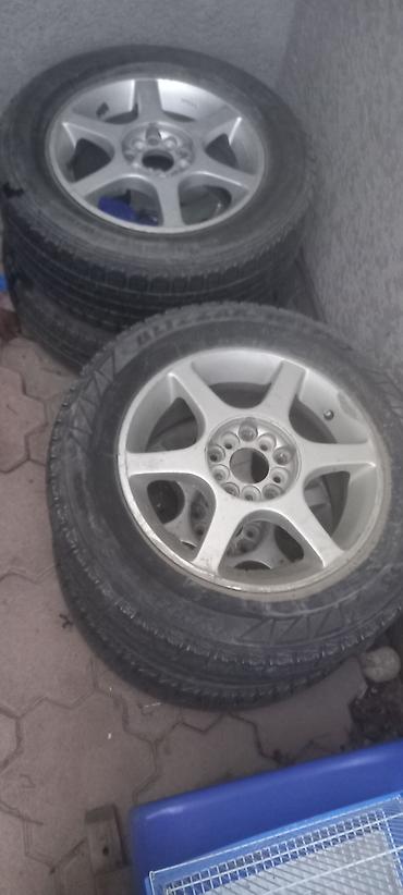 diska 13: Комплект из 4 колес в сборе: литые диски + зимние шины Bridgestone — 1