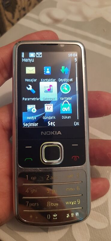 Nokia 6700 Slide, 4 GB, rəng - Gümüşü, Düyməli