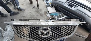 Решетки радиатора: Решетка радиатора Mazda Оригинал — 5