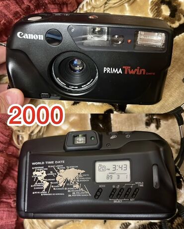 Фотоаппараты: Пленочный фотоаппарат Canon Prima Twin DATE в черном корпусе. Оснащен