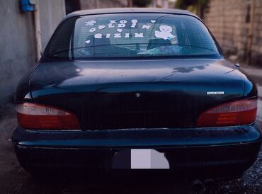 Kia: Kia Sephia sedan - Kuzov: 4 qapılı sedan, tünd yaşıl rəng - Ön hissə — 3