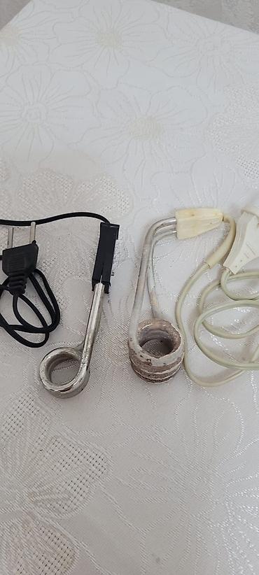 kislarodniy balon: Mini su qizdirici cay qaynatmaq ucun caskayada yerlesir — 2