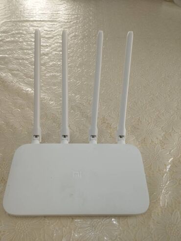 wifi modem adapter: İdeal vəziyyətdə xiomi wife router 4a1 həftə işlənib adapteri üstündə