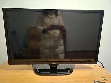 mac mini 4: Телевизор LG с плоским экраном, диагональ примерно 22–24" — 1