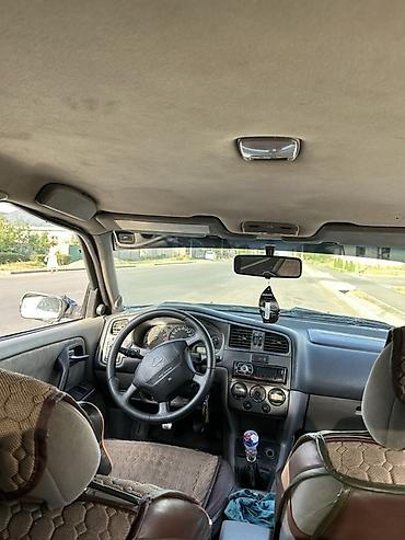 керме тоо: Nissan Primera: 1999 г., Кол менен иштөөчү, Бензин, Седан — 1