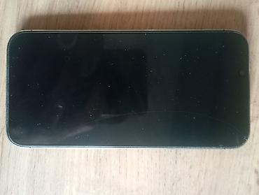 Смартфон Apple iPhone (линейка Pro) в тёмном цвете. Основные