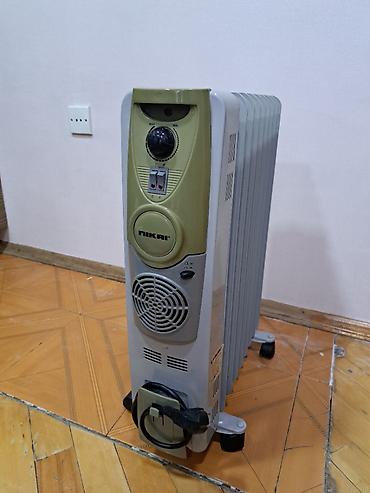 radiator islenmis: 9 seksiyali, az ishlenib, yaxshi veziyetdedir. NIKAI firmasi — 2