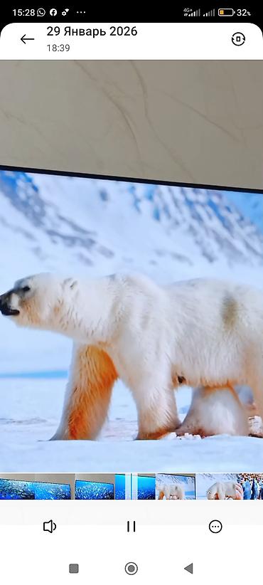 Телевизоры: Телевизор KIVI (надпись на рамке) с тонкими рамками, настенное — 7