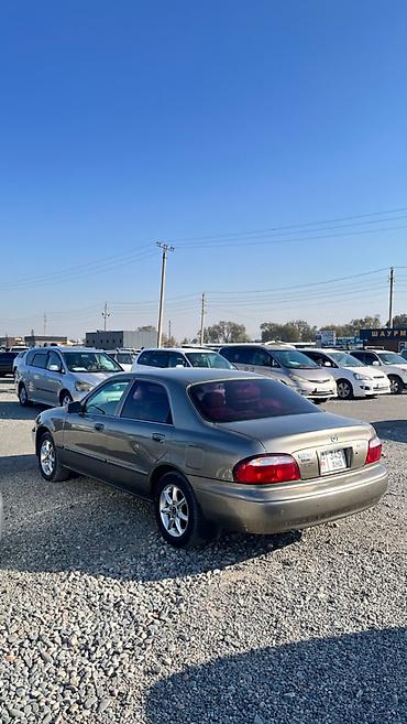 футляр для кия: Mazda Capella: 2001 г., 2 л, Автомат, Бензин, Седан — 7