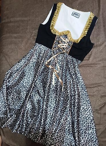 Haljine: Haljina s leopard printom i korset vezivanjem - Model: midi haljina — 1