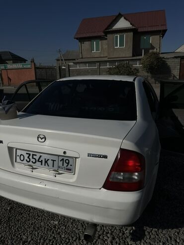 купить авто с кореи бу: Mazda Familia: 1999 г., 1.5 л, Автомат, Бензин, Седан