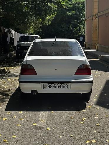 opel astra g opc: Ağ rəngli sedan, 4 qapılı, ön ötürücülü. Klassik, sadə dizaynlı kuzov — 4