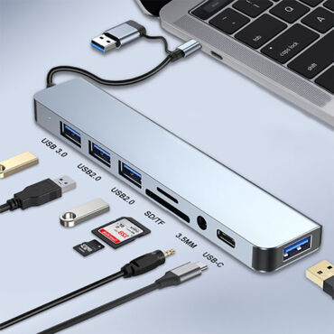 Dok-stansiya: Gümüşü rəngdə olan bu USB hub, noutbuk və ya kompüteriniz üçün əlavə