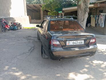капот на нексия 2: Черный седан Daewoo Nexia 1.5, оснащенный багажником на крыше для