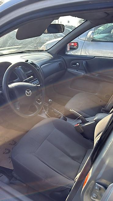 forester 2004: Mazda 323: 2003 г., 1.3 л, Механика, Бензин, Седан — 5