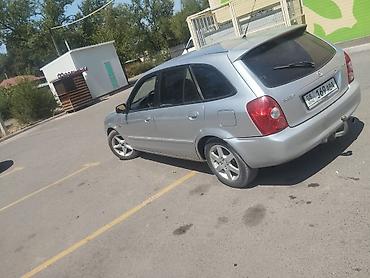 Унаа: Mazda 323: 2003 г., Кол менен иштөөчү, Бензин, Универсал — 10